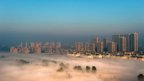 Modern cityscape against sky