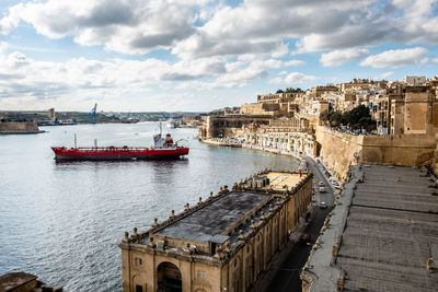 High angle view of ship in sea ant the valletta harbour against sky