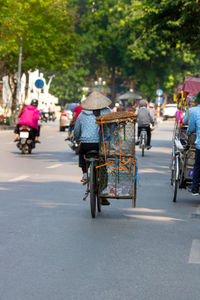 People on road in city