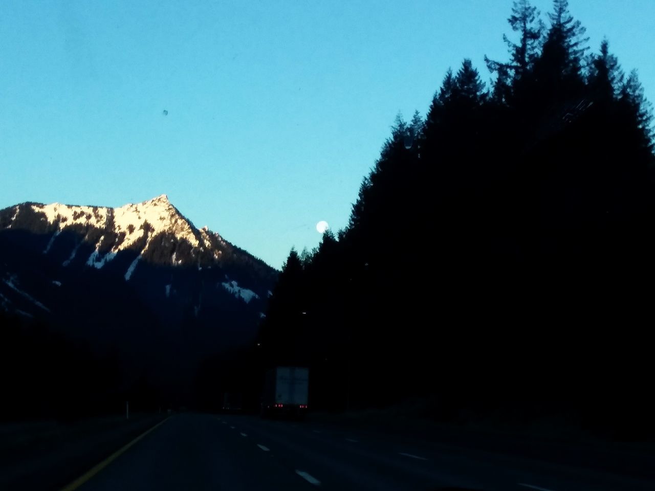 clear sky, road, no people, tree, the way forward, outdoors, blue, silhouette, nature, day, sky, mountain