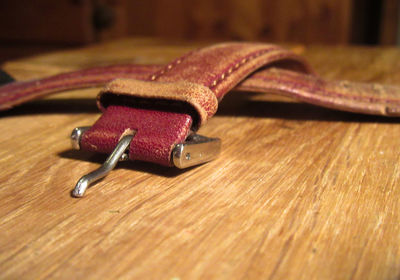 Close-up of belt on wooden table