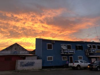 Buildings against sky during sunset