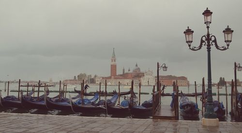 Boats moored at dock