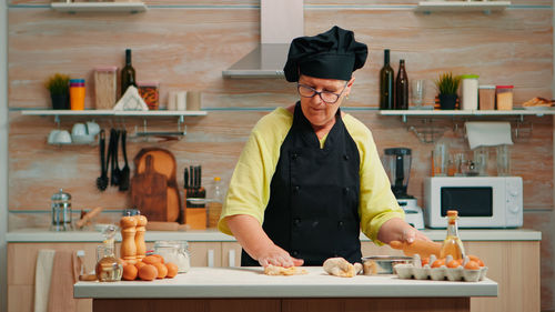 Side view of man working at table