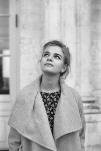 Portrait of young woman looking away