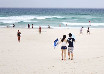 Tourists enjoying at beach
