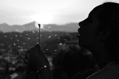 Close-up portrait of woman holding water