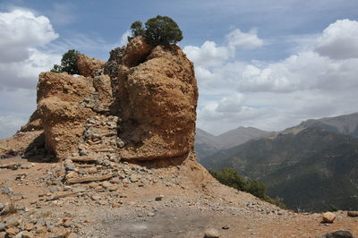 Rock formation on mountain against sky