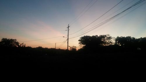 Electricity pylons at sunset