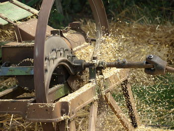 Close-up of abandoned structure on field