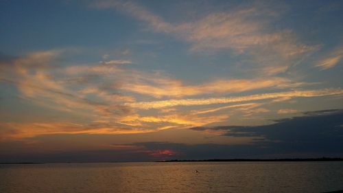 Scenic view of sea at sunset