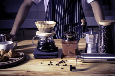 Cropped hands of person preparing food on table