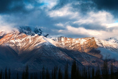 Snow covered mountains against sky