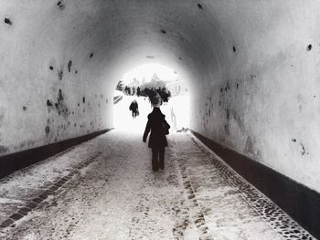 People walking in tunnel