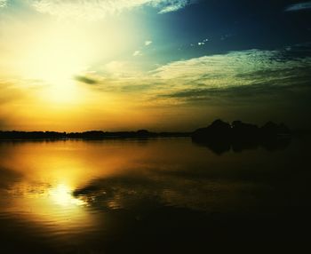 Scenic view of lake against sky during sunset