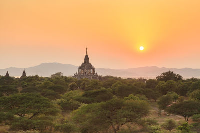 View of temple building against sky during sunset