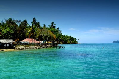 Scenic view of calm sea against blue sky