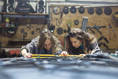 Manual workers working together in workshop