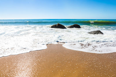 Scenic view of beach against sky