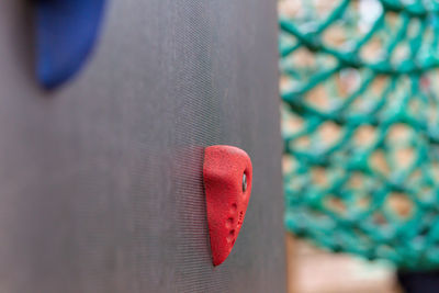 Close-up of hand holding heart shape metal