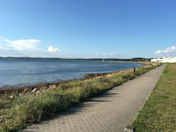 Footpath leading to calm sea