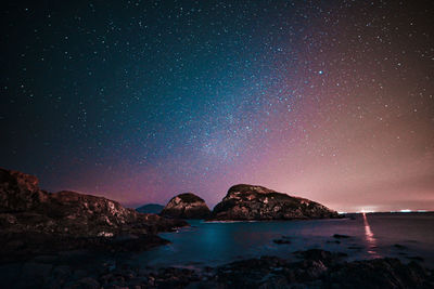 Scenic view of sea against sky at night