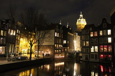 Canal in city at night