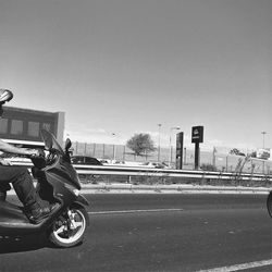 Side view of man riding bicycle on road