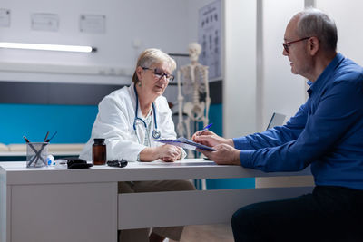 Female doctor working in office