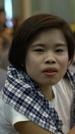 Close-up portrait of cute girl at home