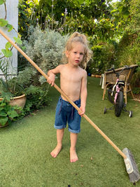 Full length of boy playing in park