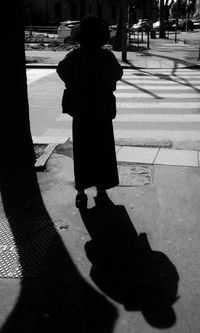 Shadow of people on street