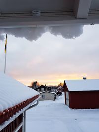 Houses against sky during winter