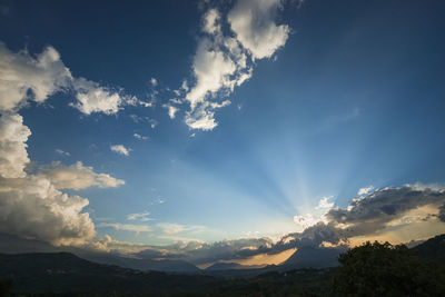 Low angle view of mountains against sky during sunset