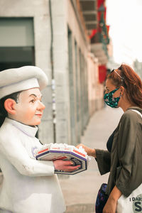 Side view of couple looking at camera