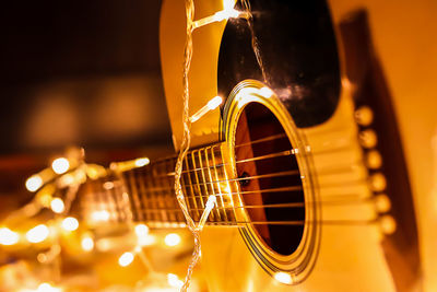 Close-up of illuminated lights on guitar