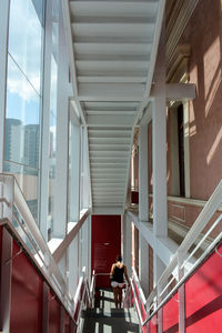 People on staircase of modern building