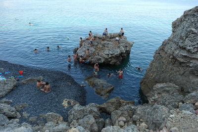 People standing on rock formation