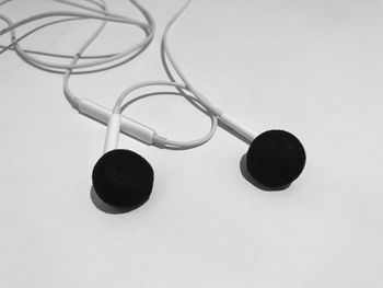 Close-up of eyeglasses on table against white background