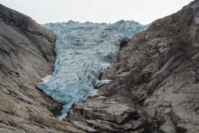 Scenic view of frozen landscape against sky