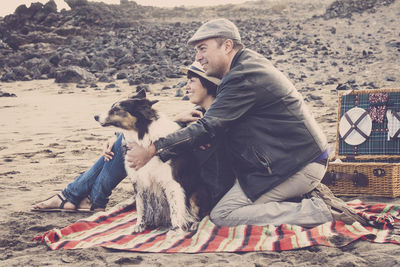 Couple with dog at beach