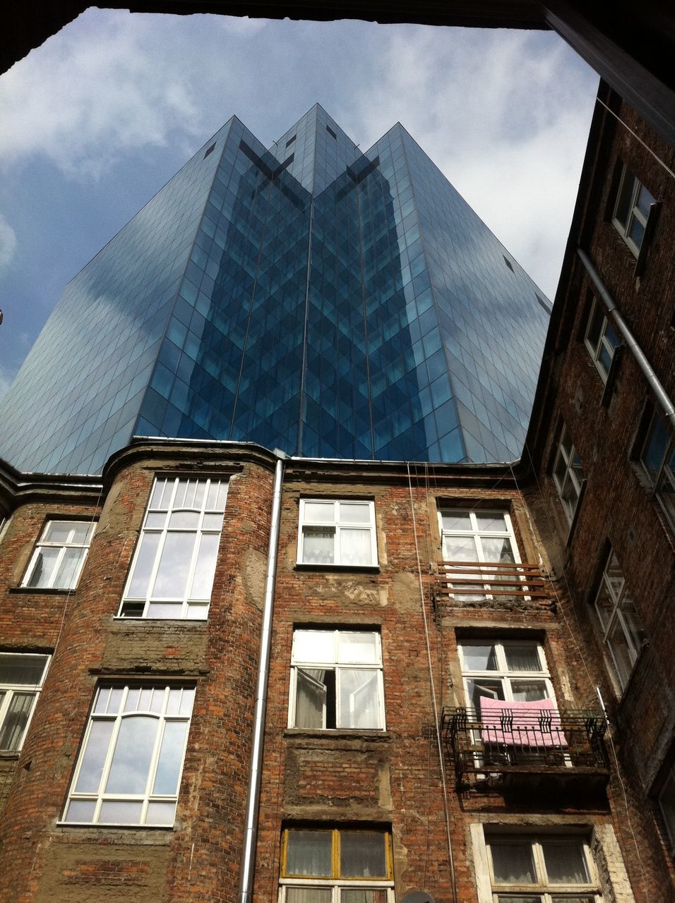 window, architecture, built structure, building exterior, glass - material, low angle view, house, reflection, sky, residential structure, day, building, no people, abandoned, transparent, indoors, sunlight, residential building, old, damaged