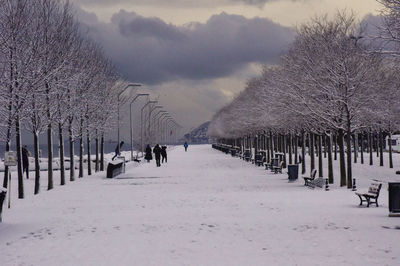 People walking on the shore on a snowy day in istanbul 