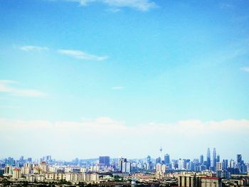 Cityscape against blue sky