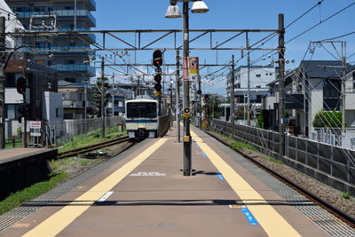 Train on railroad station platform against sky