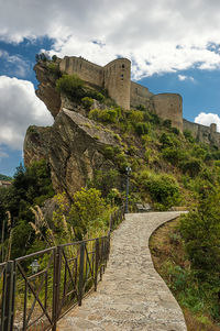 View of old ruin building against cloudy sky