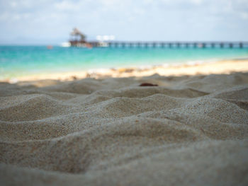 Surface level of beach against sky