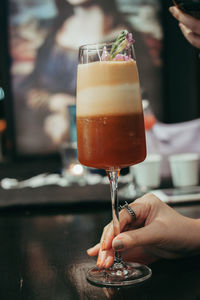 Close-up of hand holding wine glass