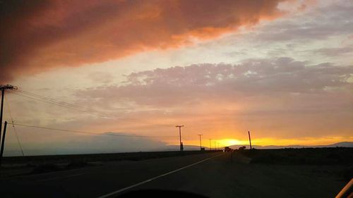 Scenic view of landscape against cloudy sky