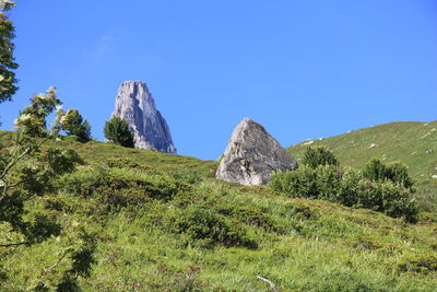 Scenic view of mountains against clear blue sky